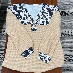 Cow print and cream waffle knit sweater